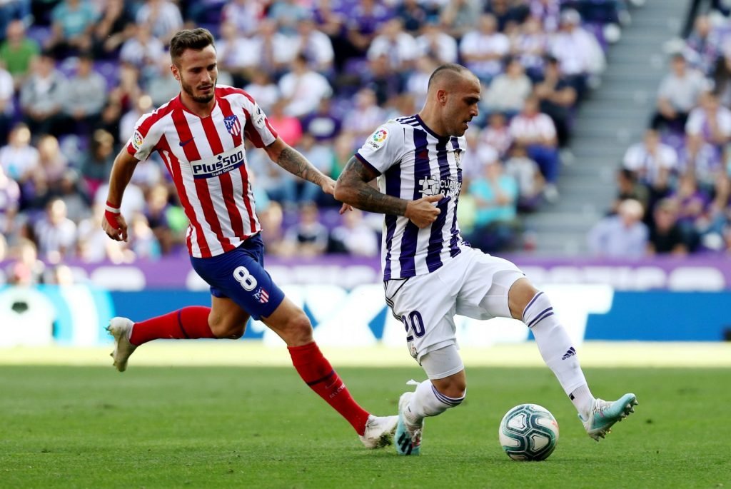 Atletico Madrid's Saul Niguez in action with Real Valladolid's Sandro Ramirez