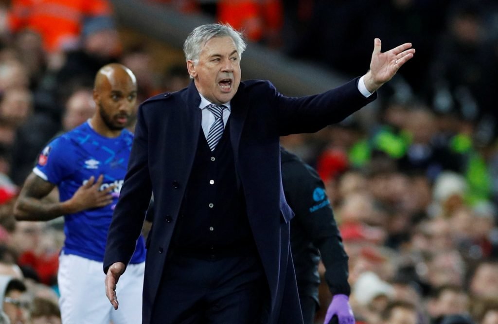 Everton manager Carlo Ancelotti gestures during FA Cup - Third Round loss to Liverpool as Fabian Delph reacts in background