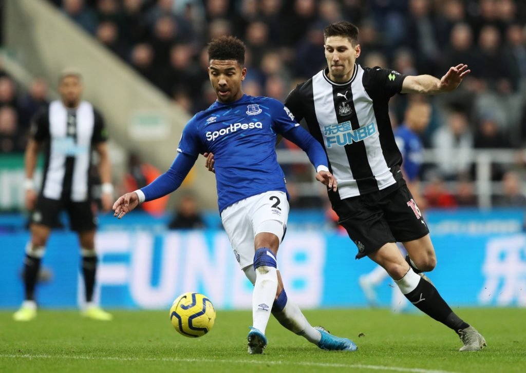 Everton's Mason Holgate in action with Newcastle United's Federico Fernandez