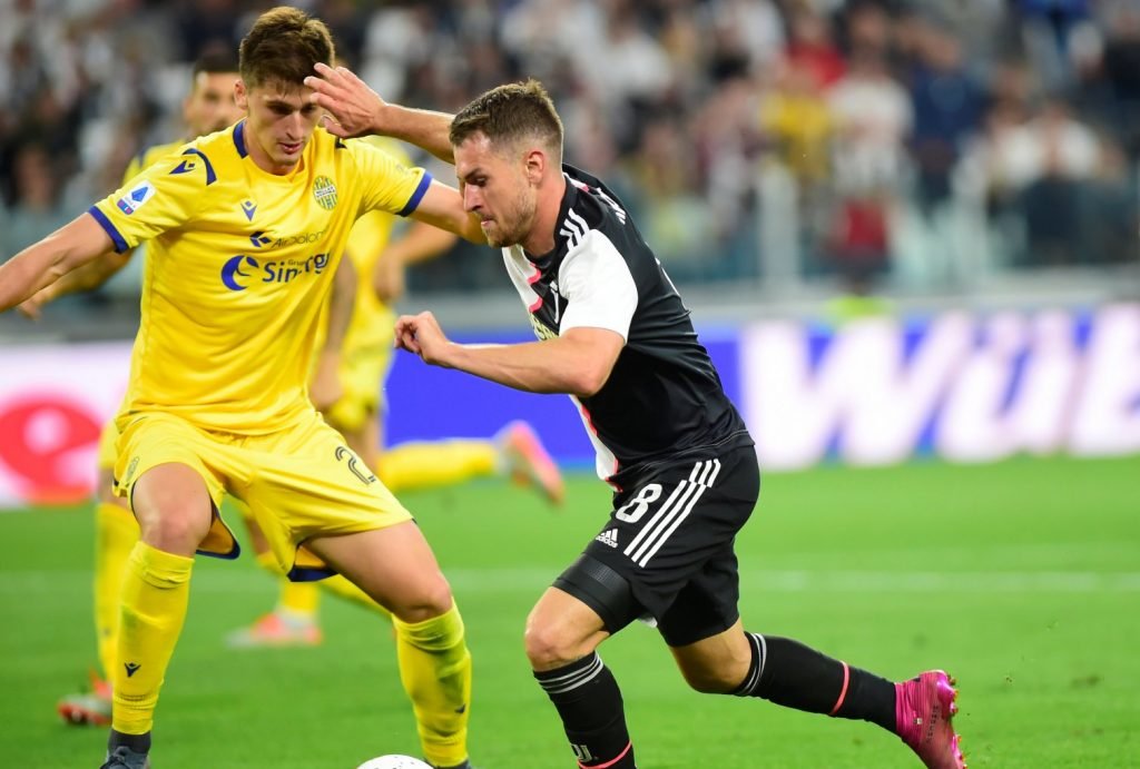 Juventus' Aaron Ramsey in action with Hellas Verona's Marash Kumbulla