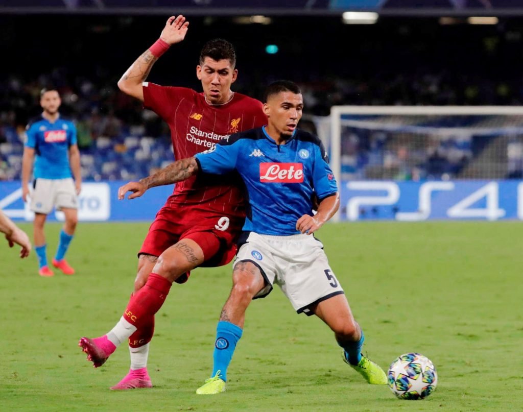 Liverpool's Roberto Firmino in action with Napoli's Allan - Champions League - Group E