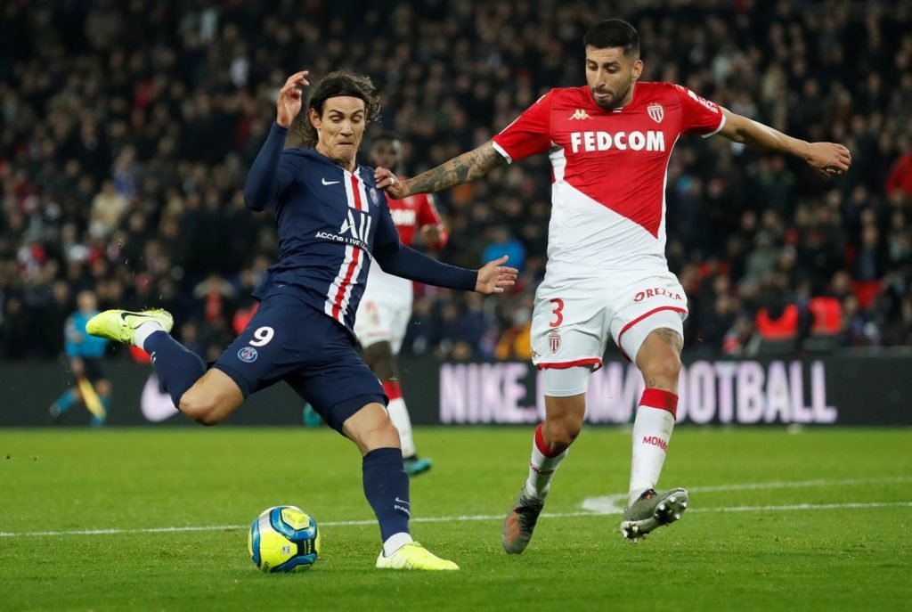 Paris St Germain's Edinson Cavani in action with AS Monaco's Guillermo Maripan