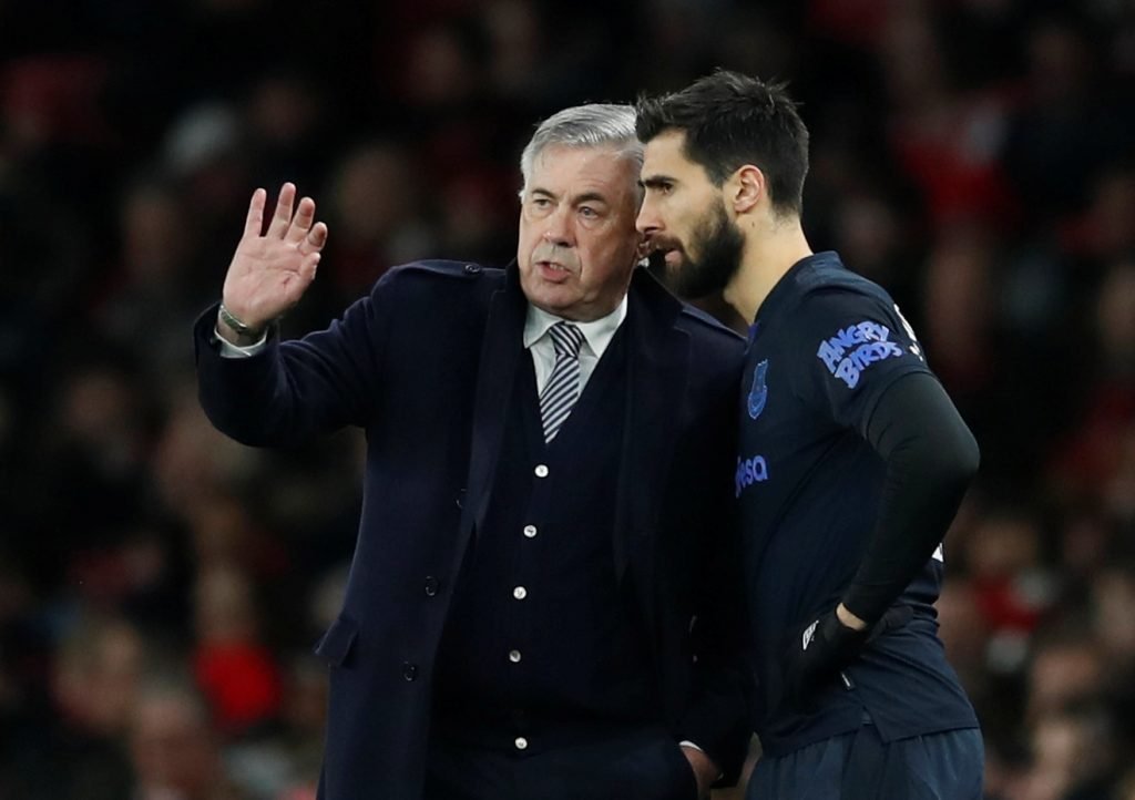 Everton's Andre Gomes receives instructions from manager Carlo Ancelotti before being substituted on v Arsenal