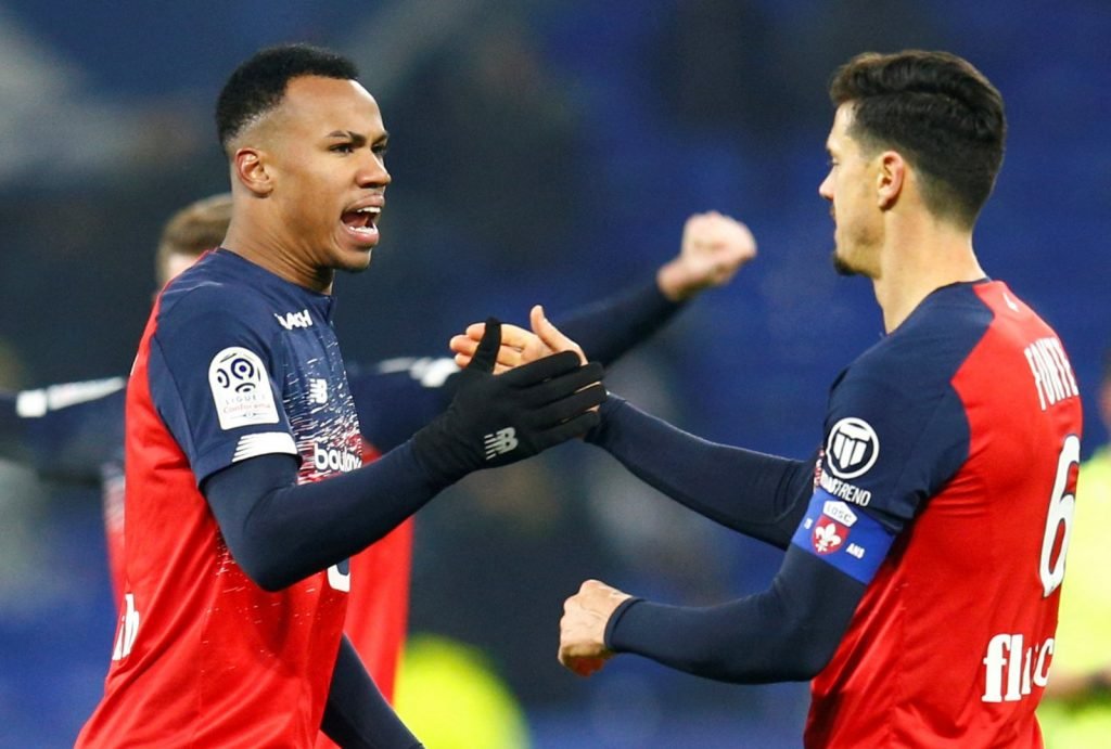 LOSC Lille's Gabriel Magalhaes celebrates with Jose Fonte after the Olympique Lyonnais match