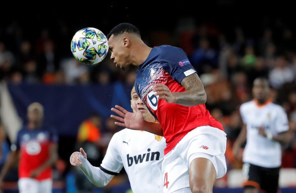 LOSC Lille's Gabriel Magalhaes in action with Valencia's Rodrigo