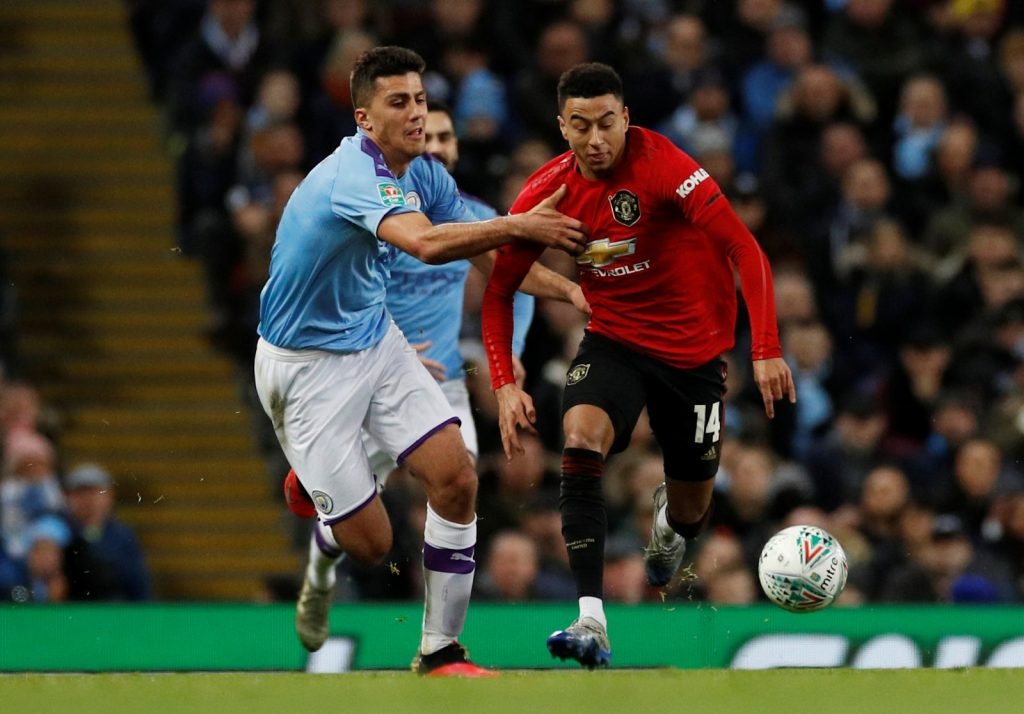 Manchester City's Joao Cancelo in action with Manchester United's Jesse Lingard