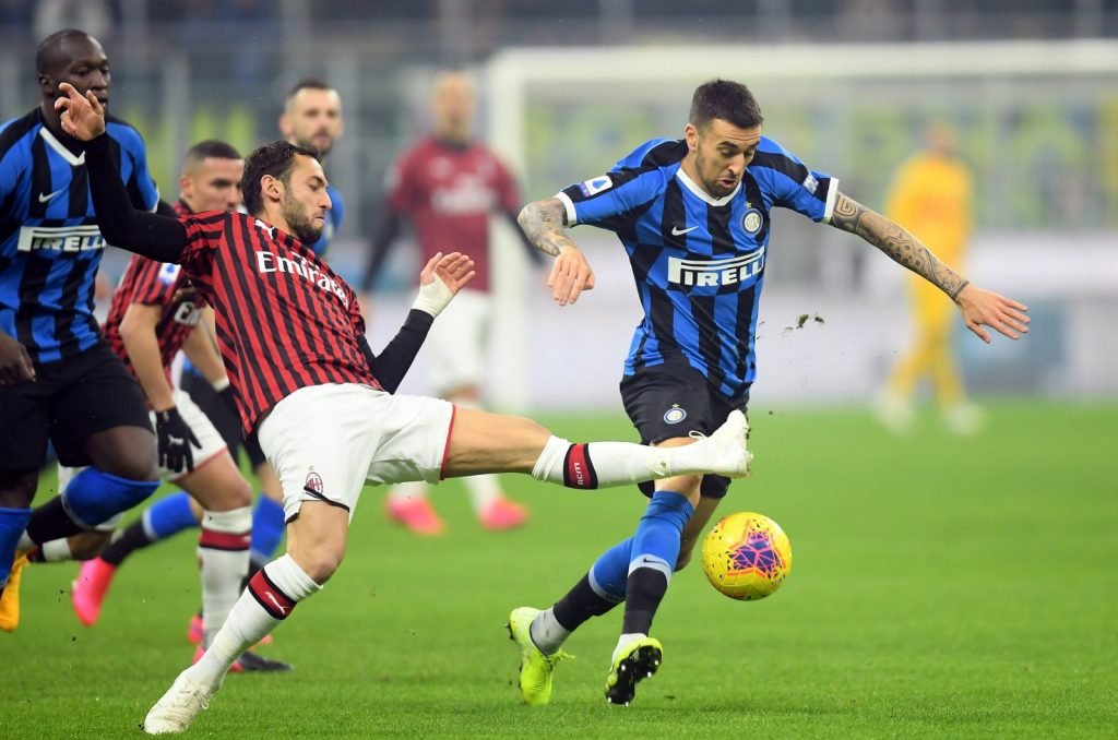 Inter Milan's Matias Vecino in action with AC Milan's Hakan Calhanoglu