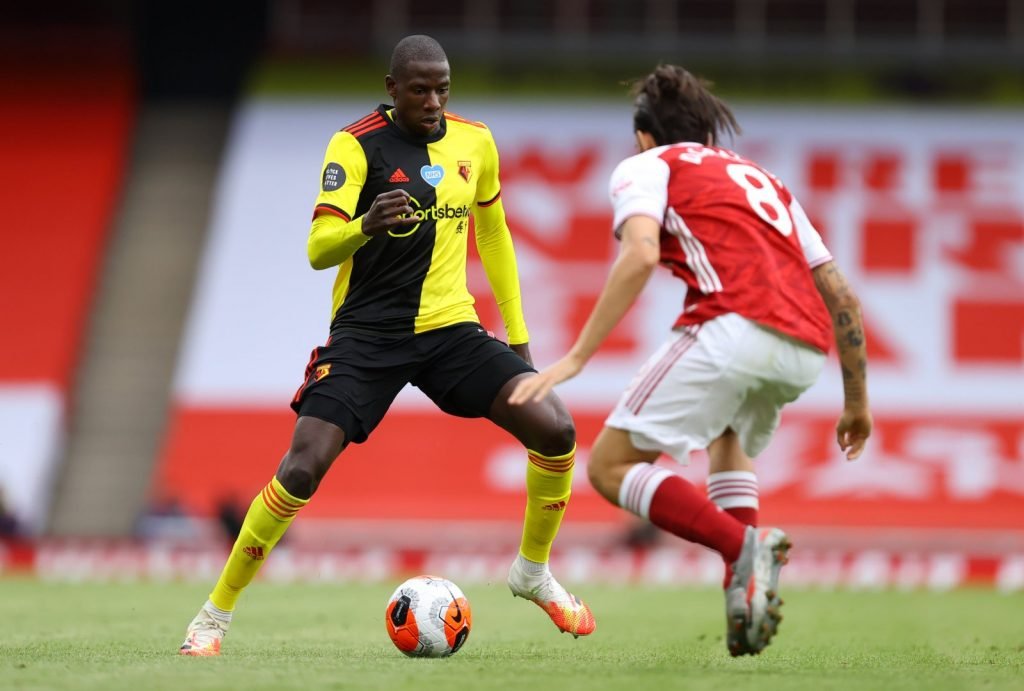 Watford's Abdoulaye Doucoure in action with Arsenal's Dani Ceballos