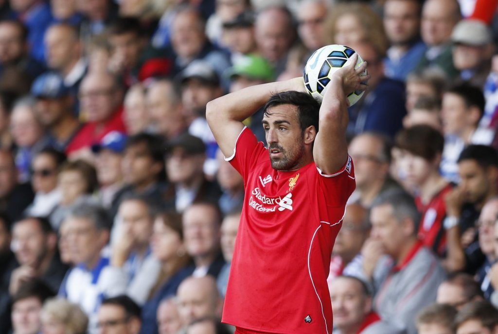 Liverpool's Jose Enrique takes a throw-in v Queens Park Rangers