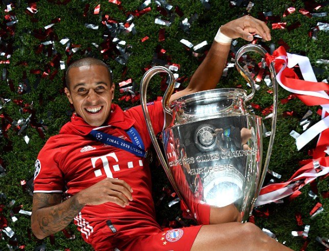 Bayern-Munich's-Thiago-Alcantara-poses-with-the-Champions-League-trophy