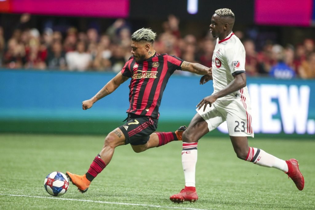 Atlanta United forward Josef Martinez (7) kicks the ball against Toronto FC defender Chris Mavinga