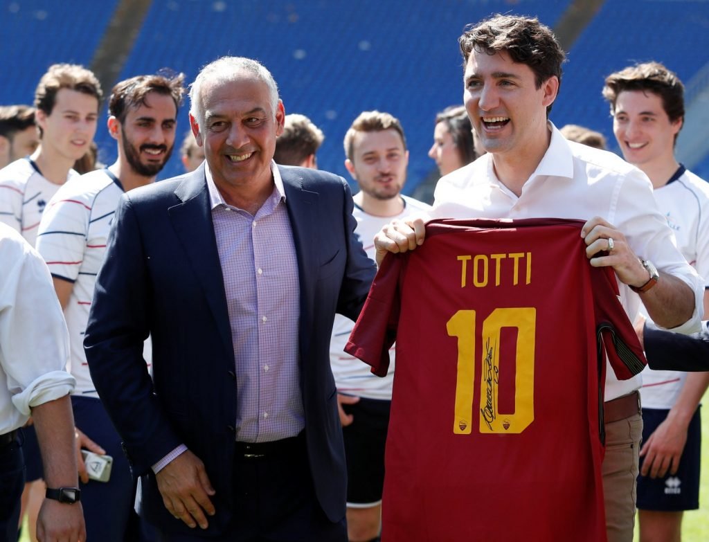 Canada's Prime Minster Justin Trudeau poses with AS Roma's president James Pallotta as he holds an AS Roma's jersey signed by Francesco Totti