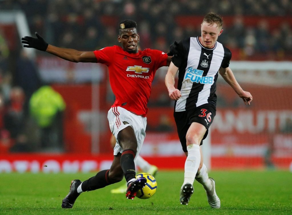 Manchester United's Paul Pogba in action with Newcastle United's Sean Longstaff