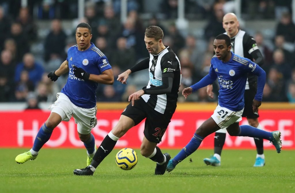 Newcastle United's Florian Lejeune in action with Leicester City's Ricardo Pereira and Youri Tielemans