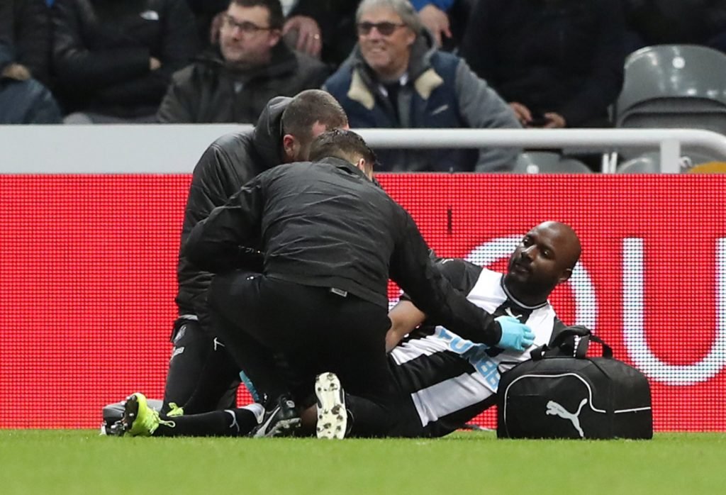 Newcastle United's Jetro Willems receives medical attention after sustaining an injury