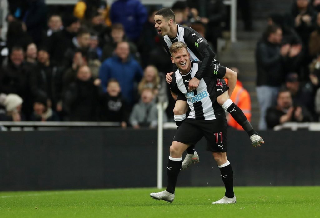 Newcastle United's Matt Ritchie and Miguel Almiron celebrate after Rochdale's Eoghan O'Connell scored an own goal in FA Cup Third Round Replay