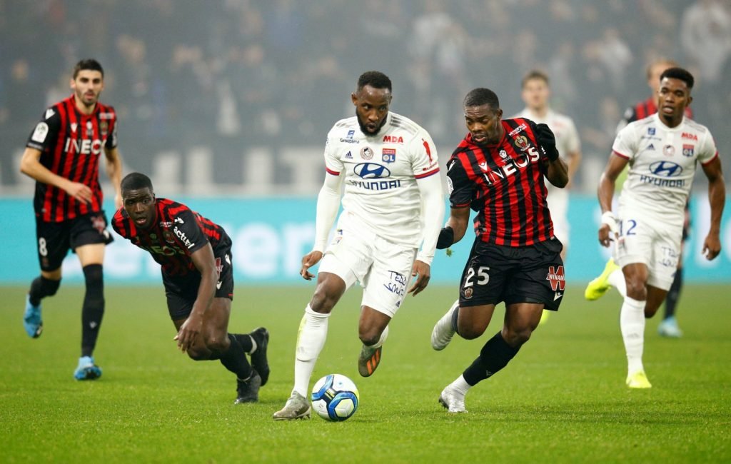 Olympique Lyonnais' Moussa Dembele in action with OGC Nice's Wylan Cyprien
