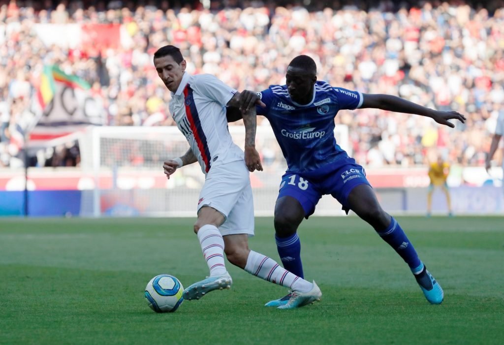 Paris St Germain's Angel Di Maria in action with RC Strasbourg's Ibrahima Sissoko