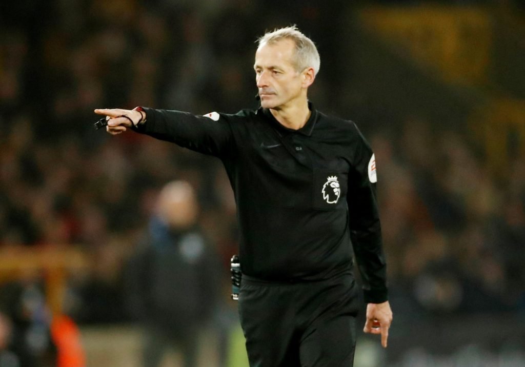Referee Martin Atkinson signals a VAR review before he awards a penalty to Manchester City v Wolverhampton Wanderers
