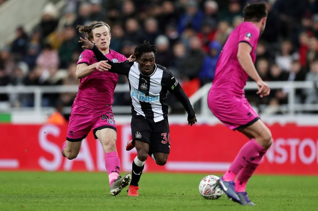 Rochdale's Luke Matheson in action with Newcastle United's Christian Atsu