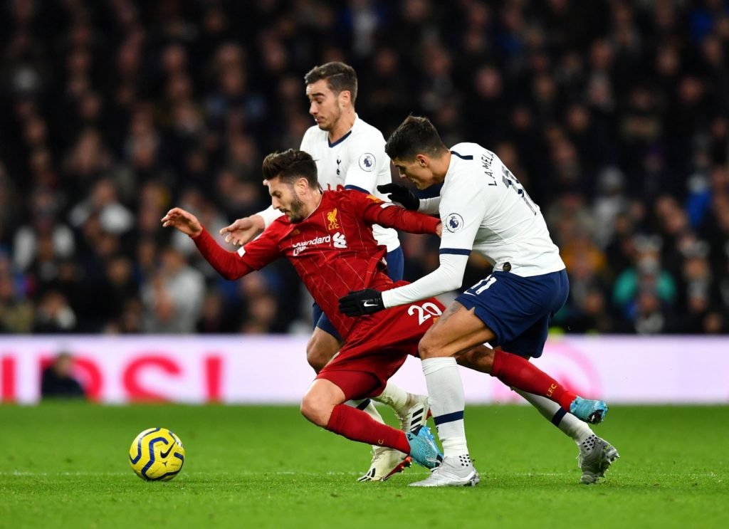 Liverpool's Adam Lallana in action with Tottenham Hotspur's Harry Winks and Erik Lamela