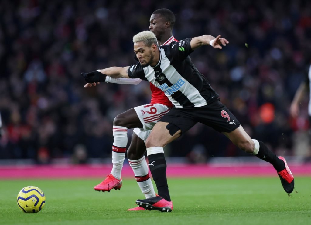 Newcastle United's Joelinton in action with Arsenal's Nicolas Pepe