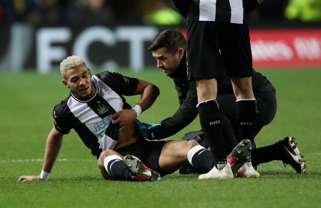 Newcastle United's Joelinton receives medical attention after sustaining an injury v Oxford United in FA Cup Fourth Round Replay