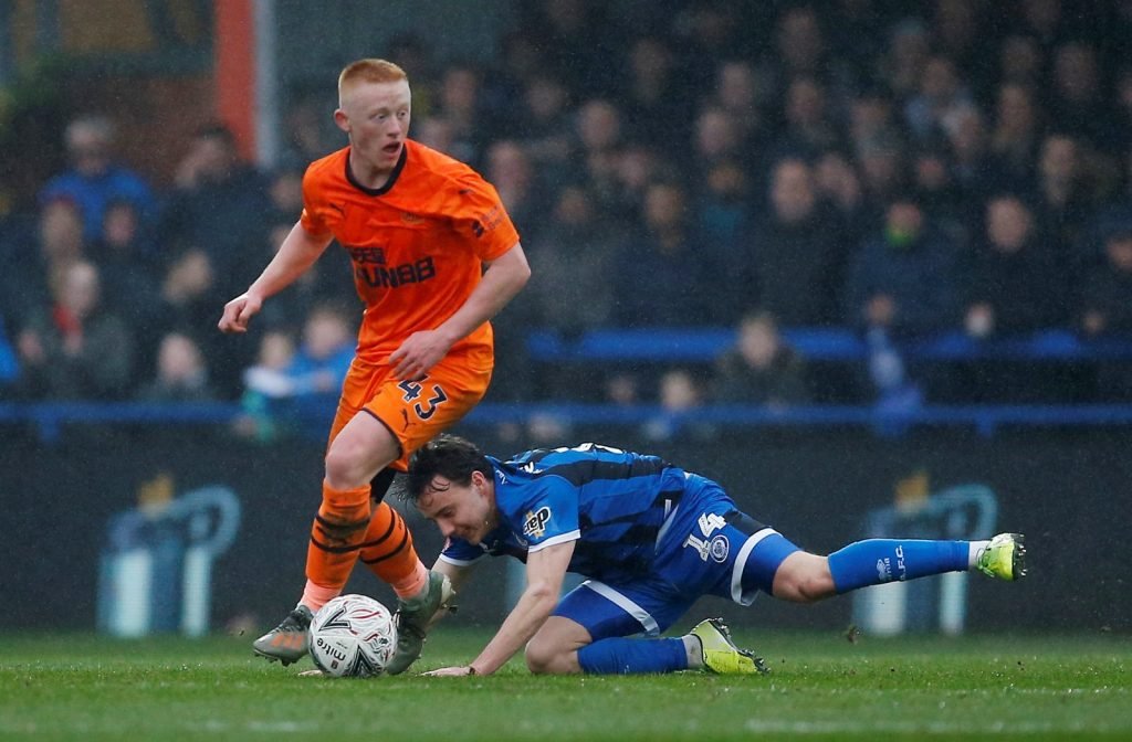Newcastle United's Matthew Longstaff in action with Rochdale's Oliver Rathbone