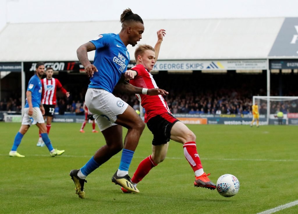 Peterborough's Ivan Toney in action with Lincoln City's Jake Hesketh