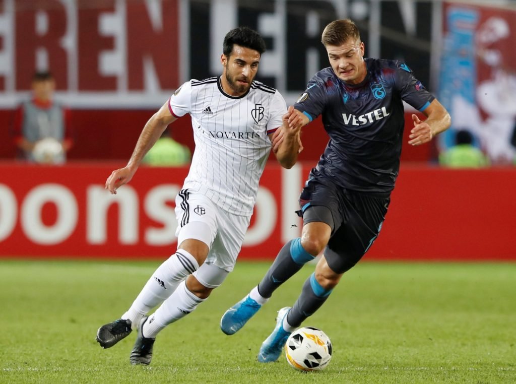Trabzonspor's Alexander Sorloth in action with Basel's Eray Comert