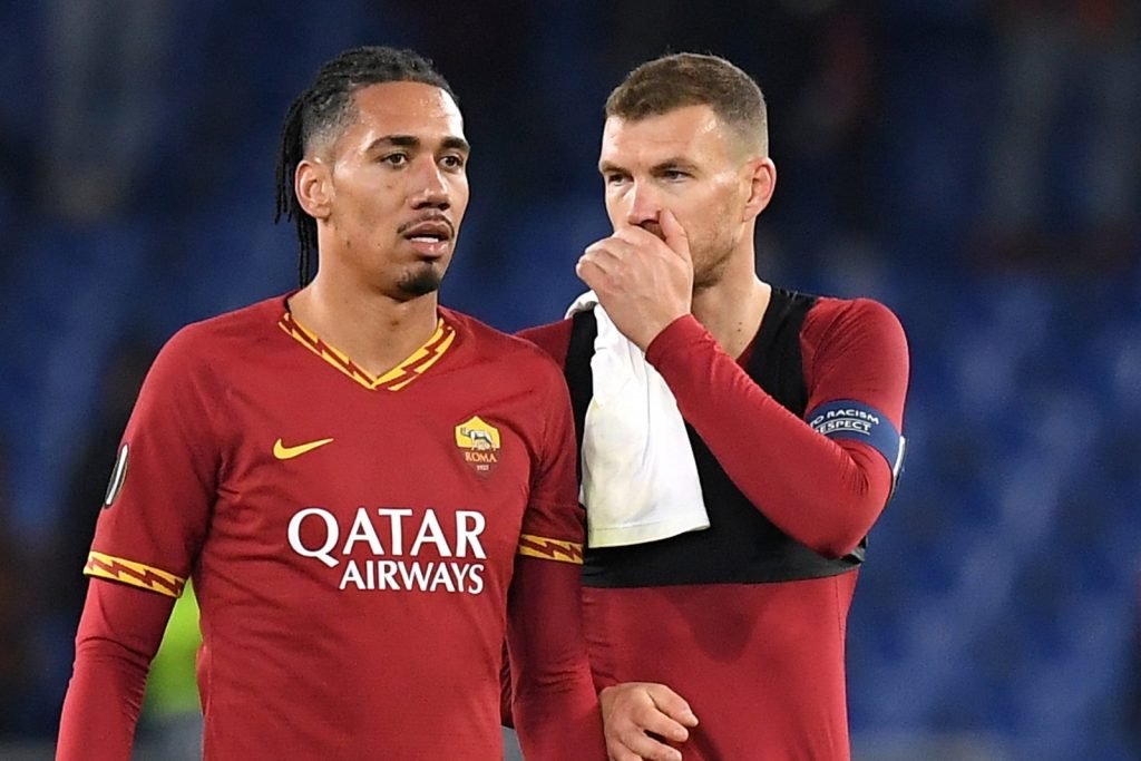 AS Roma's Edin Dzeko speaks to Chris Smalling after the Europa League - Round of 32 First Leg v Gent