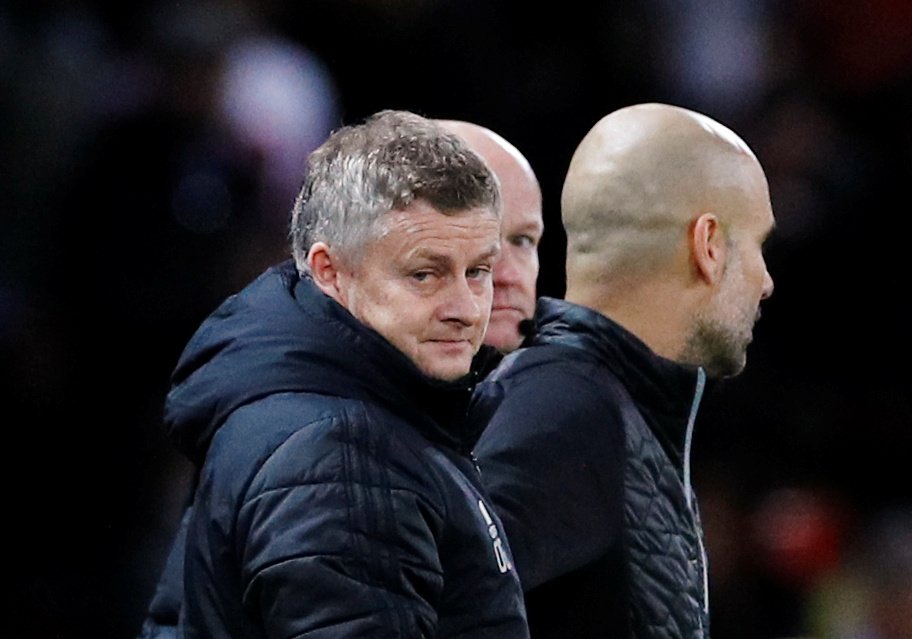 Manchester United manager Ole Gunnar Solskjaer with Manchester City manager Pep Guardiola after the Carabao Cup - Semi Final First Leg