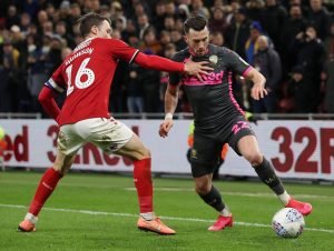 Middlesbrough's Jonny Howson in action with Leeds United winger Jack Harrison
