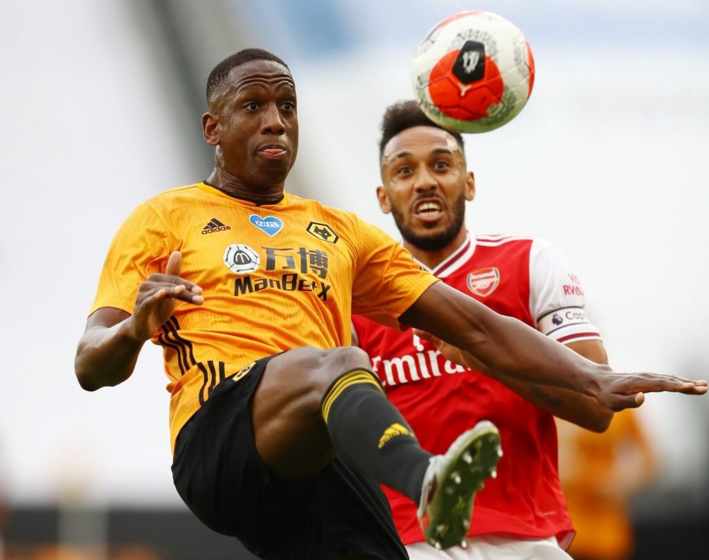 Wolverhampton Wanderers' Willy Boly in action with Arsenal's Pierre-Emerick Aubameyang