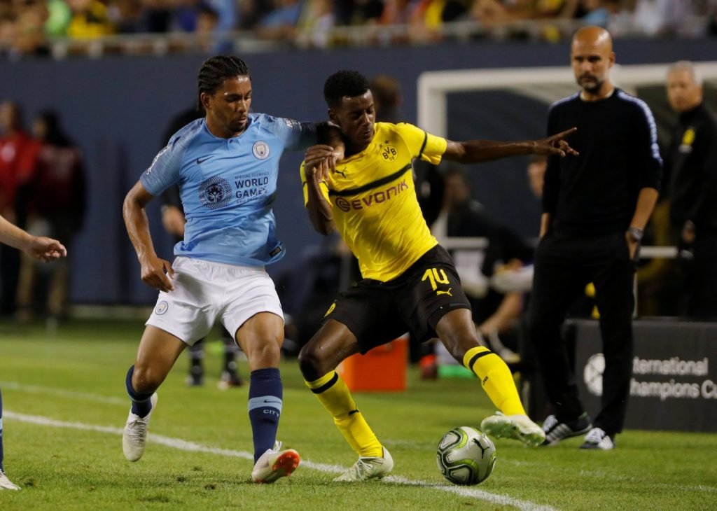 Douglas Luiz in action for Manchester City