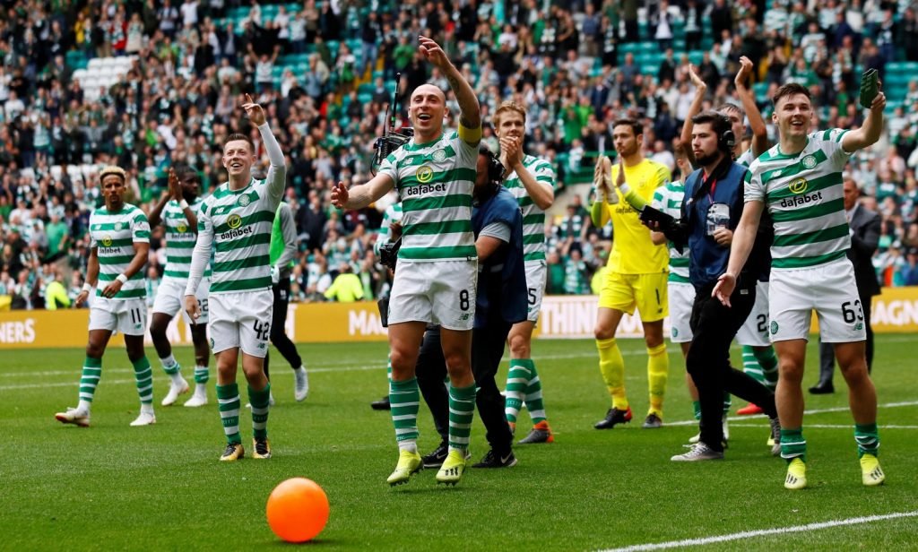 Celtic celebrate a victory over Rangers