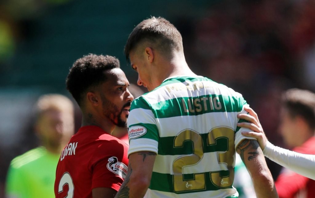 Shay Logan clashes with Celtic's Mikael Lustig