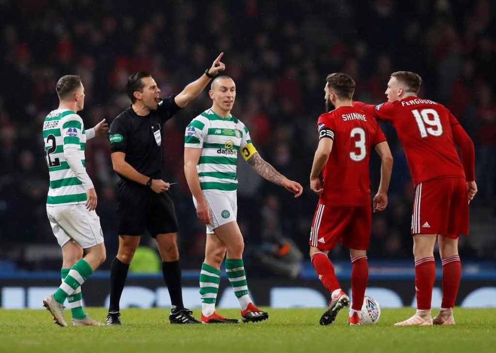 Graeme Shinnie clashes with Celtic players